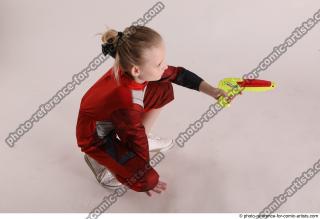 DENISA SITTING POSE WITH GUN